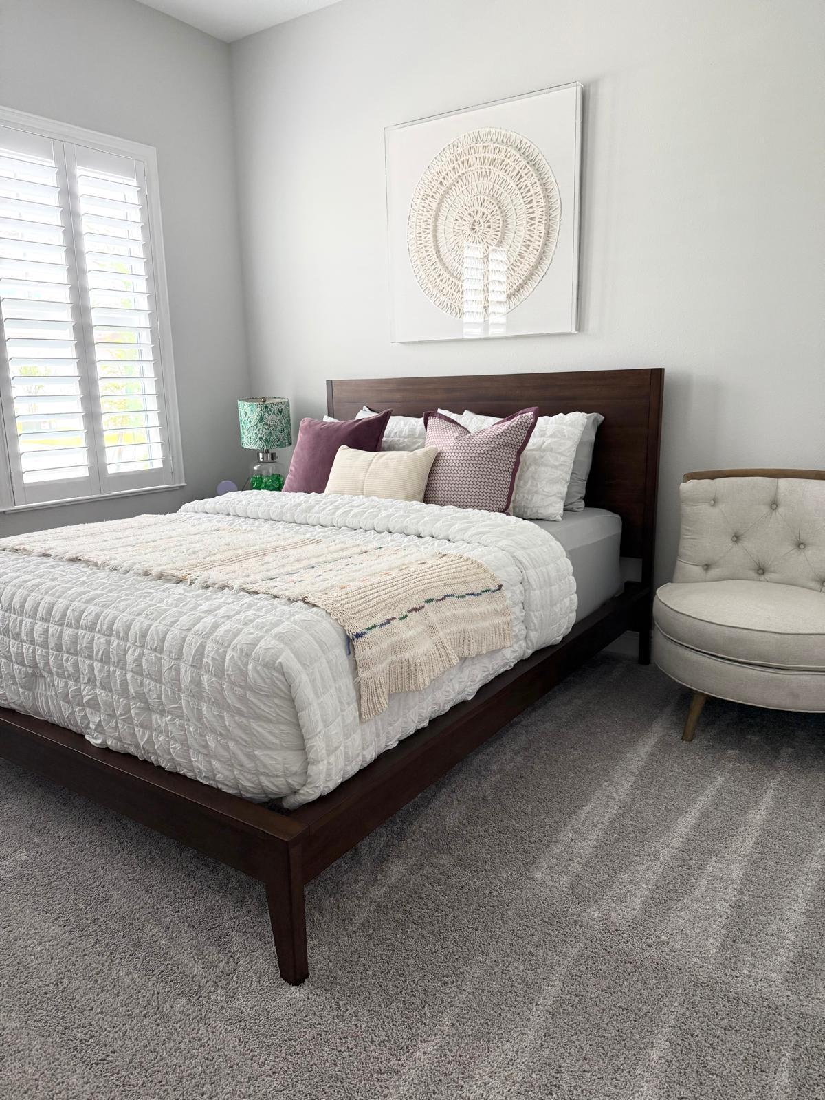 Freshly cleaned bedroom with the bed neatly made