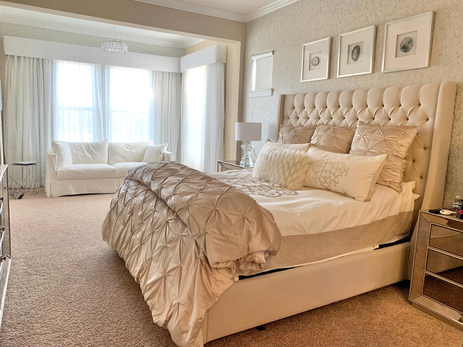 Clean, elegant bedroom with the bed neatly made