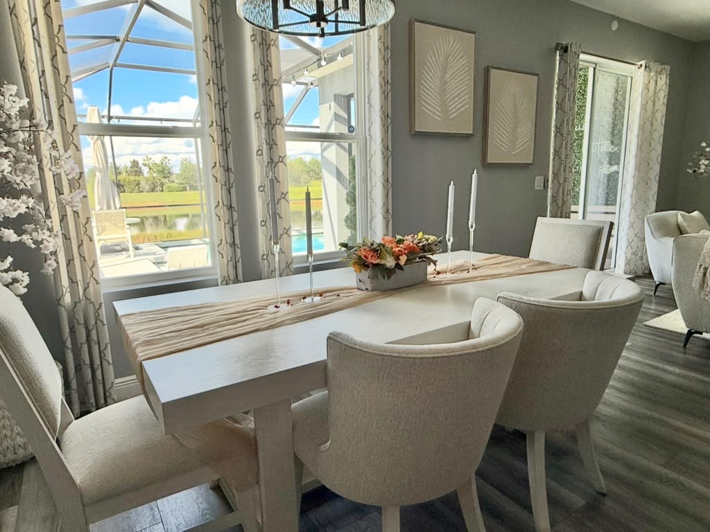 Clean, bright dining room with table set